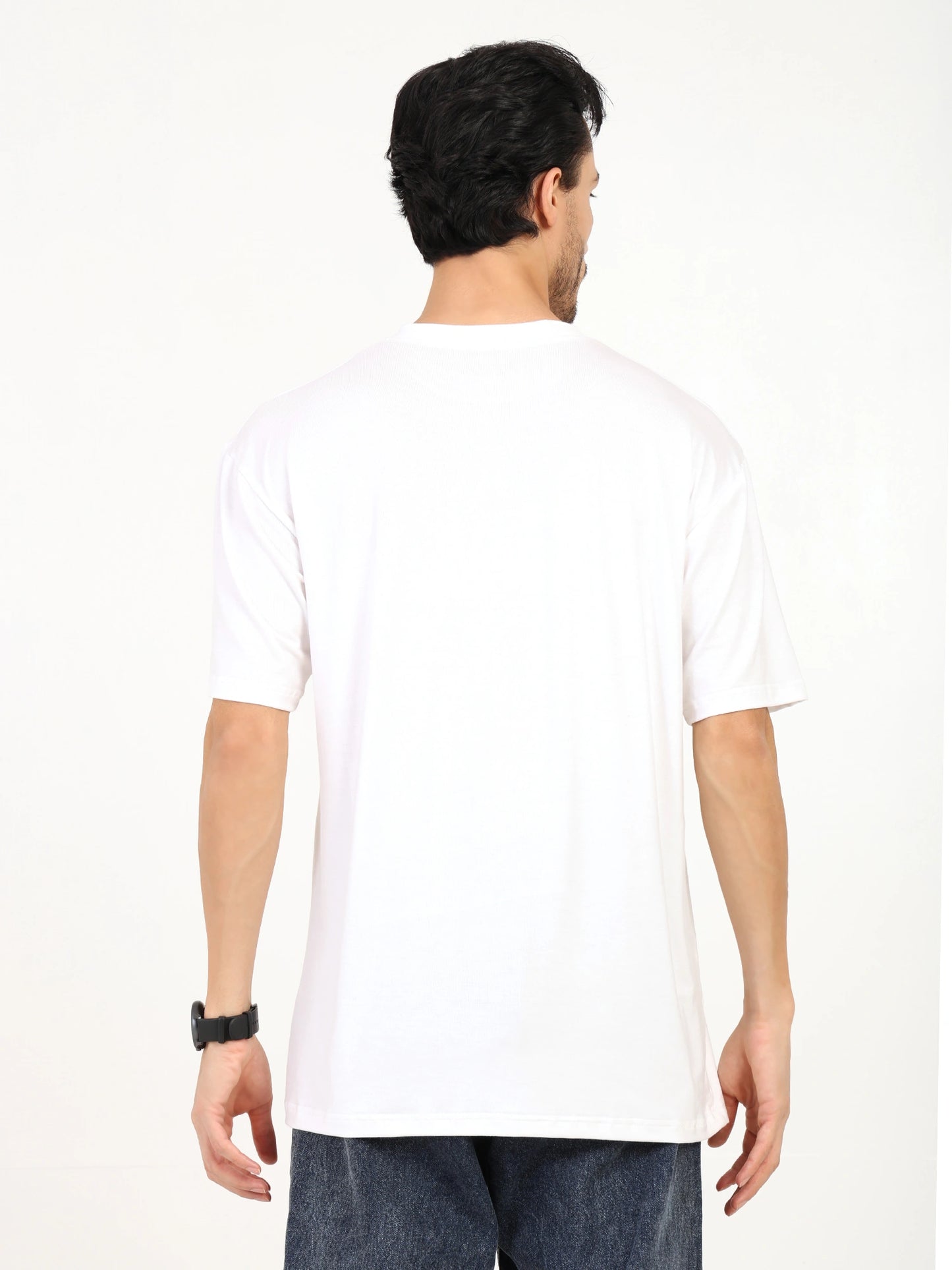 Back view of a man wearing an oversized bamboo T-shirt, showcasing its loose fit and soft fabric.
