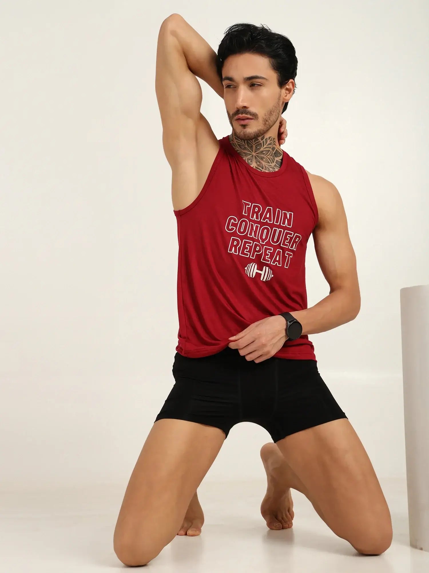 Model showcasing Bamboo Men's Ultra-Soft Trunks & Boxers in black, wearing a red tank top with gym motivational text.