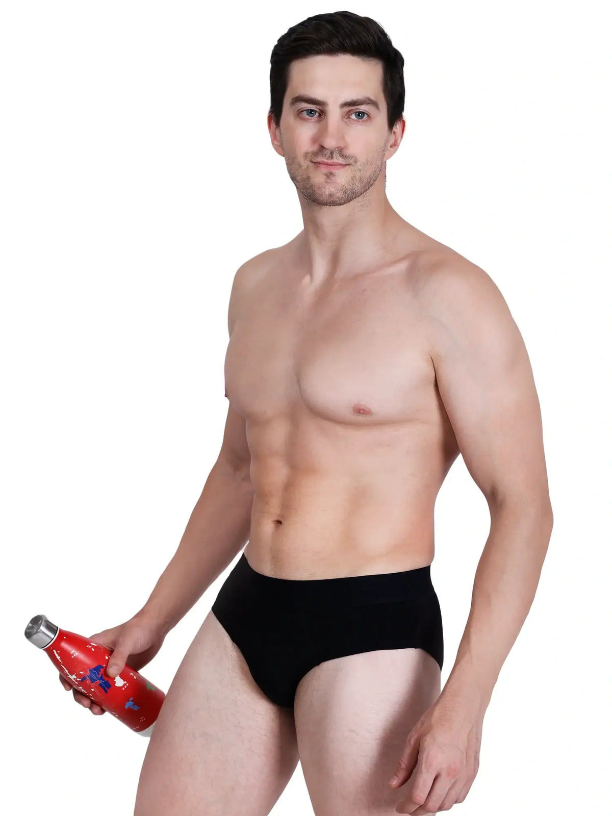 Model wearing black bamboo men's underwear, showcasing comfort and style. Holds a red water bottle.