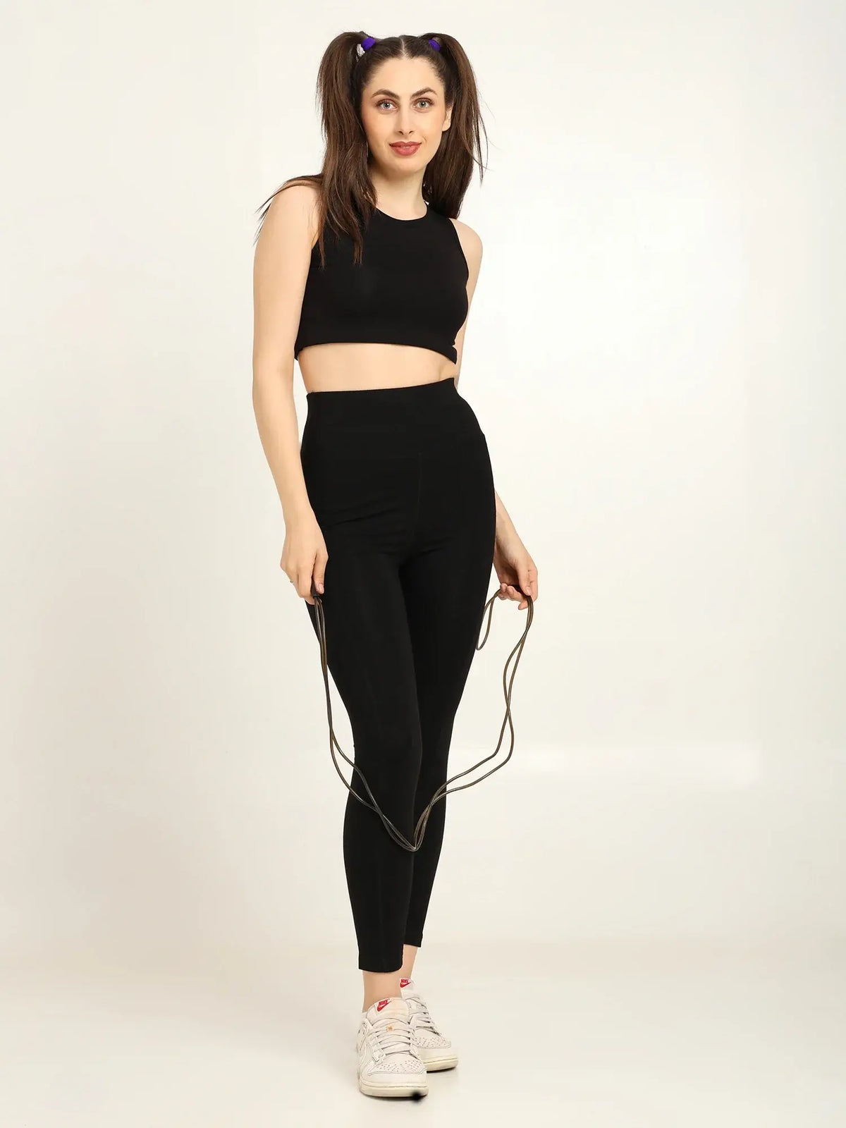 Model showcasing women's high-waist bamboo yoga pants with side pockets and crop top, perfect for workouts and yoga.