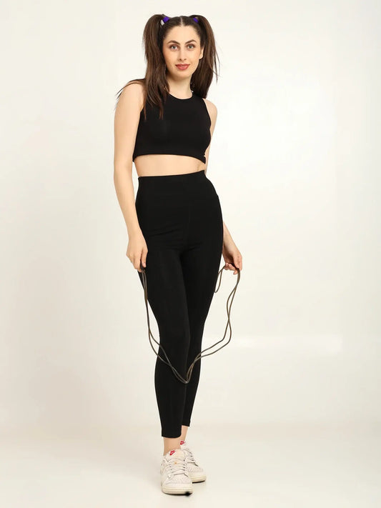 Model showcasing women's high-waist bamboo yoga pants with side pockets and crop top, perfect for workouts and yoga.