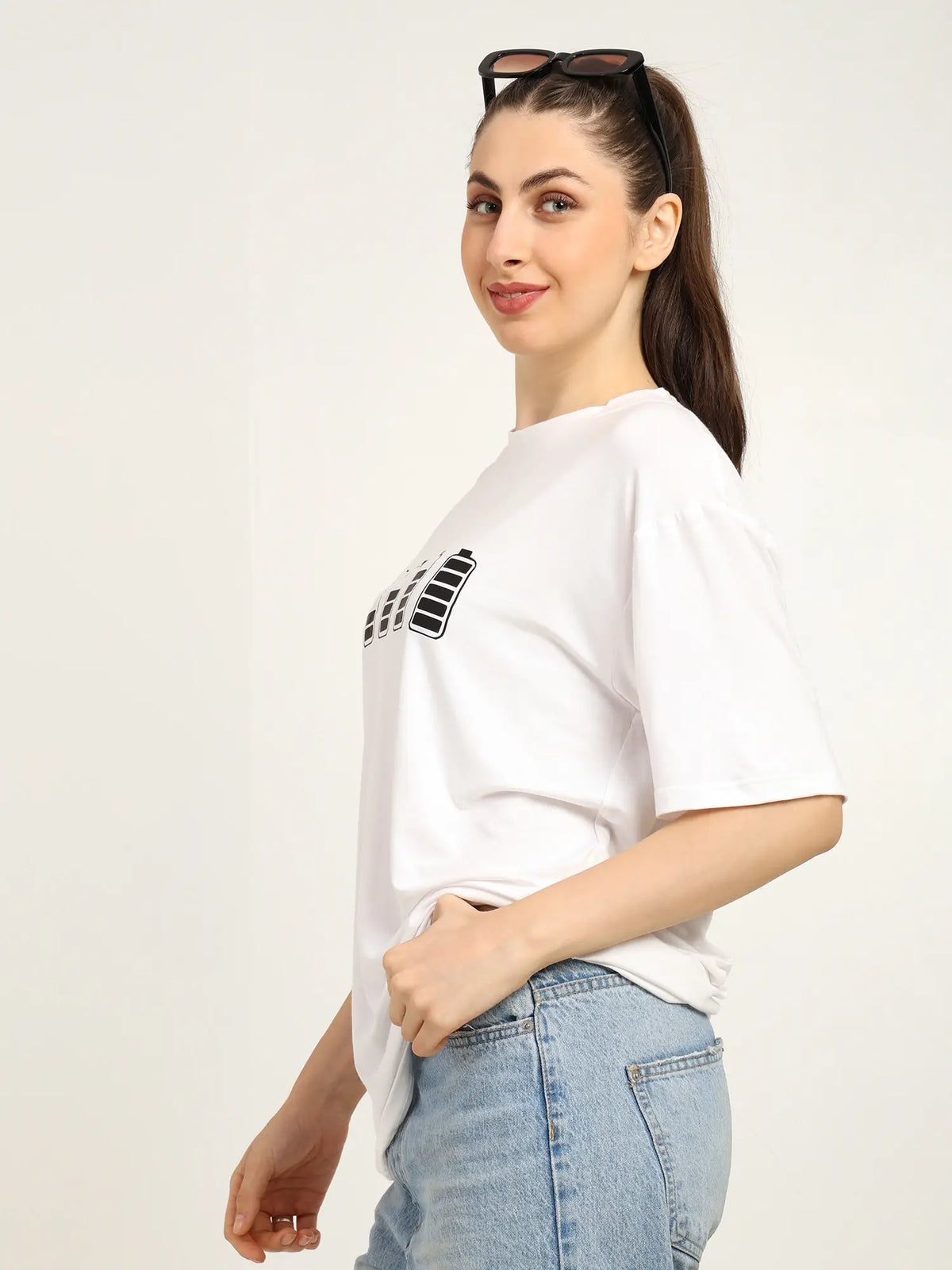 Model showcasing a women oversized bamboo t-shirt in white, ideal for streetwear and sustainable fashion.
