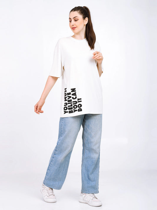 Women oversized bamboo T-shirt in white with graphic print, styled with light denim and sneakers for casual streetwear.