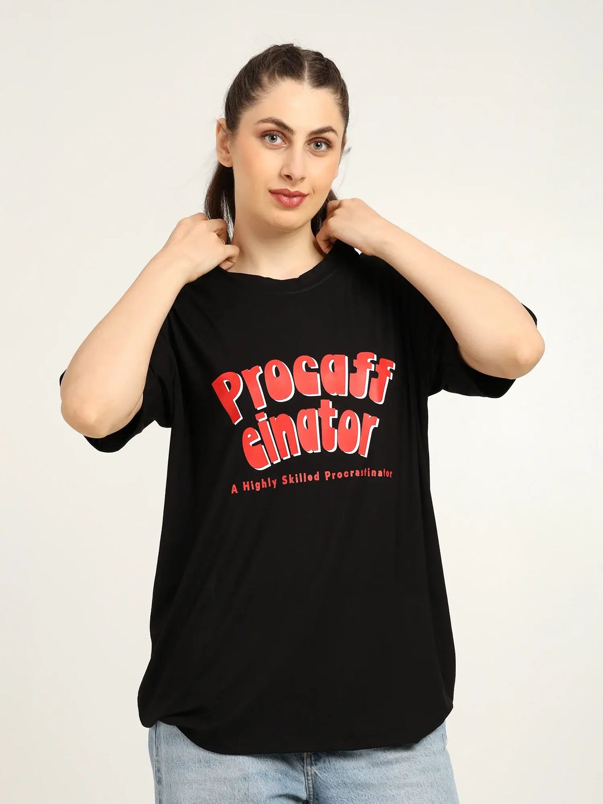 Person wearing a black t-shirt with red text on a white background