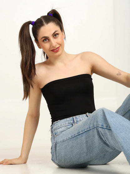Gen Z woman wearing a black bamboo tube top and relaxed jeans, showcasing stylish and sustainable fashion.